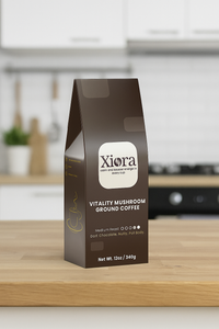 Vitality Mushroom Coffee 12oz bag displayed on kitchen counter. Medium roast with Lion’s Mane and Chaga for energy and mental clarity.
